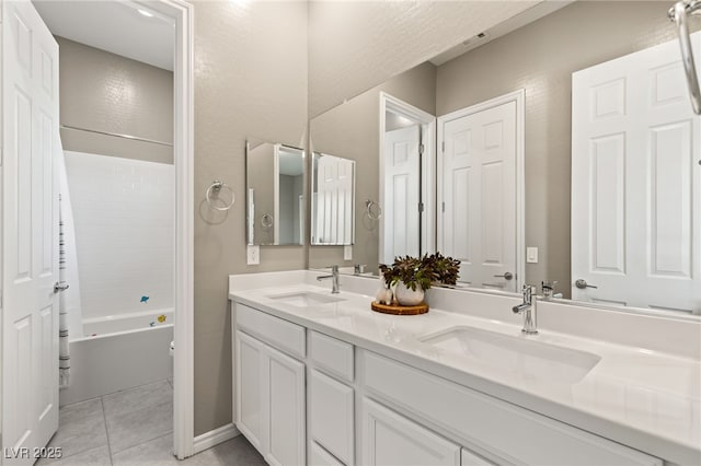 bathroom featuring tile patterned floors, vanity, and shower / tub combination