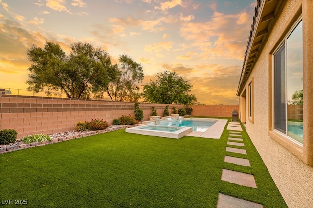 yard at dusk featuring a fenced in pool