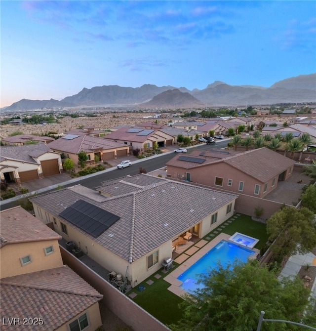 drone / aerial view featuring a mountain view