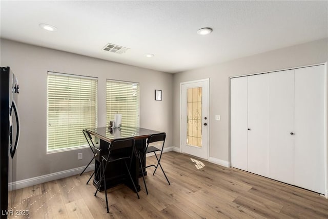 dining room with light wood-type flooring