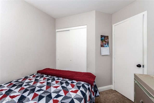 carpeted bedroom featuring a closet