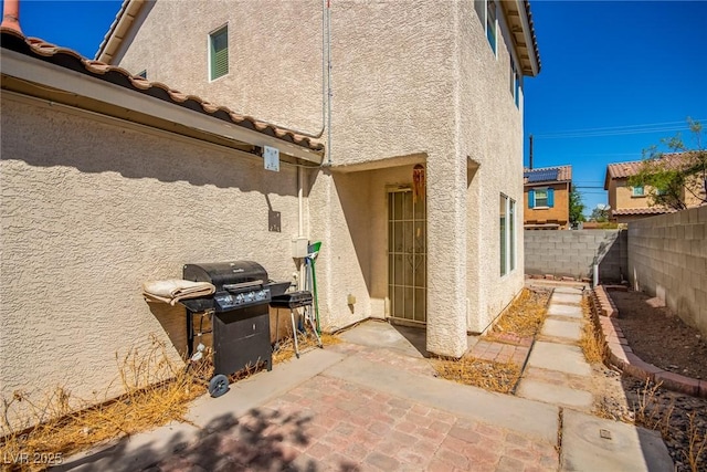 view of property exterior with a patio