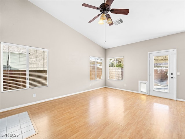 spare room with high vaulted ceiling, ceiling fan, and light wood-type flooring