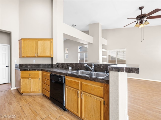 kitchen featuring sink, dishwasher, kitchen peninsula, ceiling fan, and light hardwood / wood-style floors