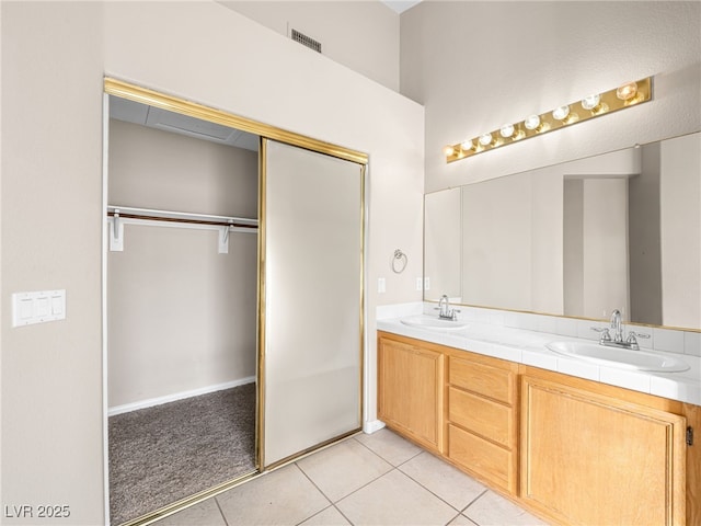 bathroom with vanity and tile patterned floors