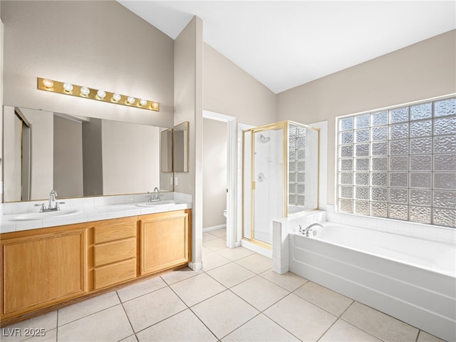 full bathroom featuring vaulted ceiling, plus walk in shower, tile patterned flooring, vanity, and toilet