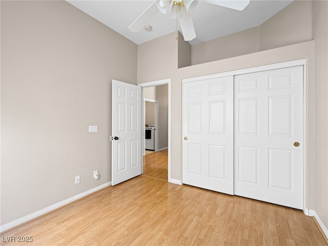 unfurnished bedroom featuring vaulted ceiling, ceiling fan, light hardwood / wood-style floors, and a closet