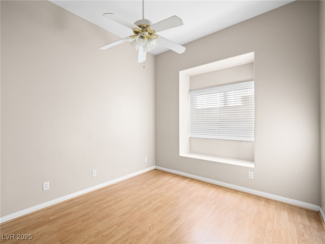 empty room with ceiling fan and light wood-type flooring