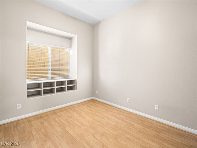 unfurnished room with light hardwood / wood-style flooring