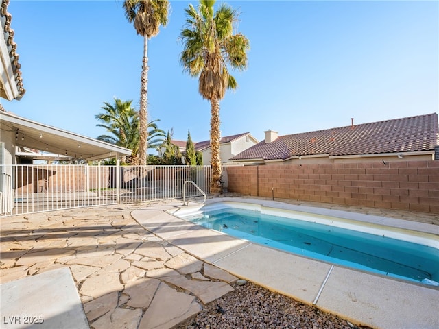 view of swimming pool featuring a patio area