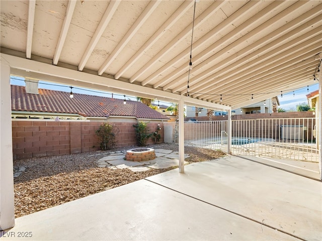 view of patio / terrace with an outdoor fire pit