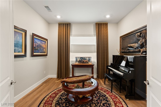 living area with light hardwood / wood-style floors