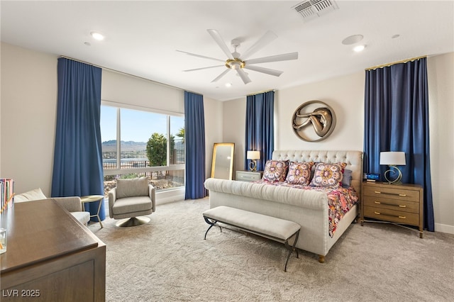 carpeted bedroom with ceiling fan