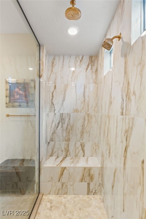 bathroom with tiled shower