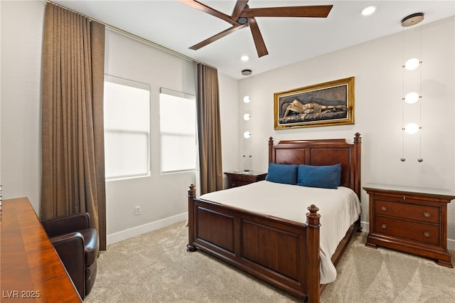 bedroom with light colored carpet and ceiling fan