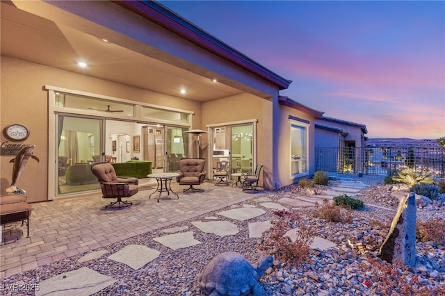 view of patio terrace at dusk