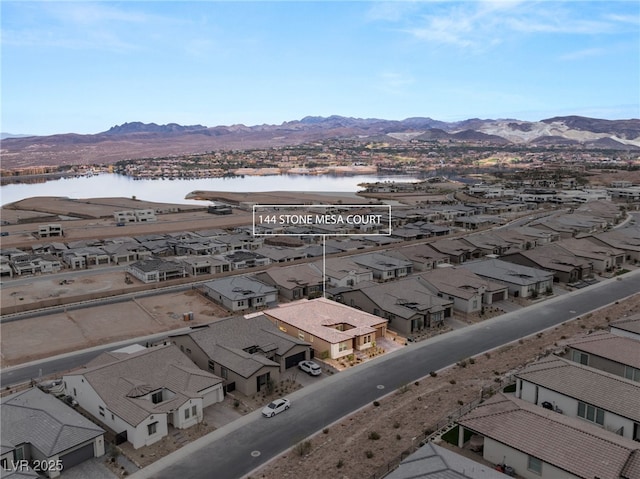 bird's eye view featuring a water and mountain view