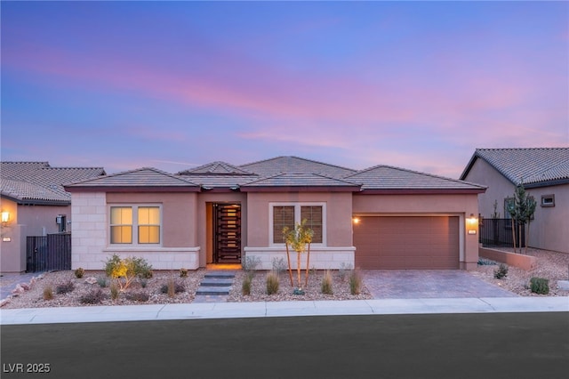 prairie-style house featuring a garage