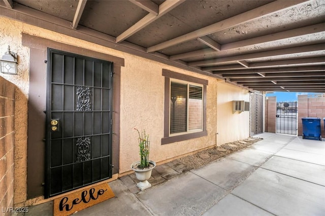 entrance to property featuring a wall mounted air conditioner