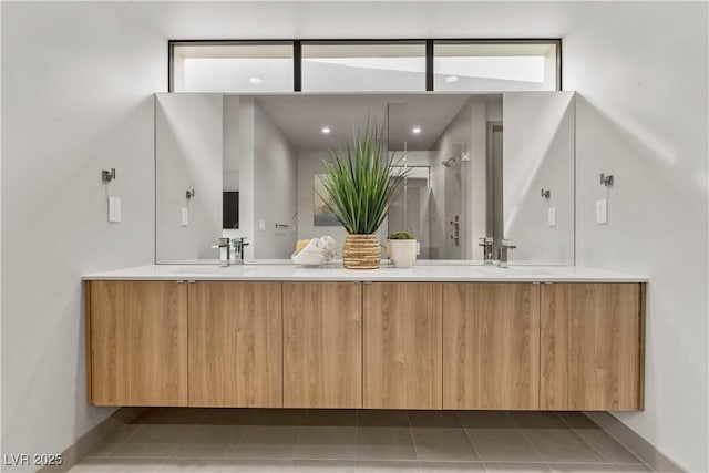 bathroom featuring double vanity and tile patterned flooring