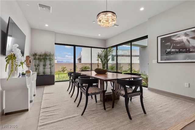 dining area featuring baseboards, recessed lighting, visible vents, and an inviting chandelier