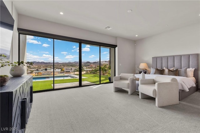 bedroom with access to outside, light carpet, visible vents, and recessed lighting