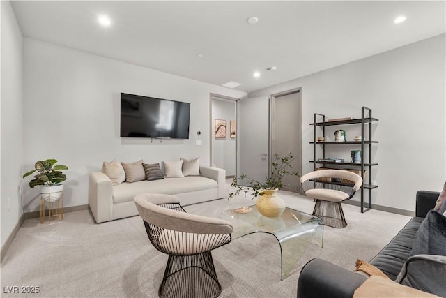 living room with recessed lighting, light carpet, and baseboards