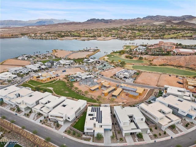 birds eye view of property featuring a water and mountain view