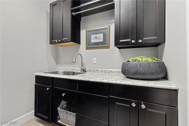 kitchen with sink and light hardwood / wood-style floors