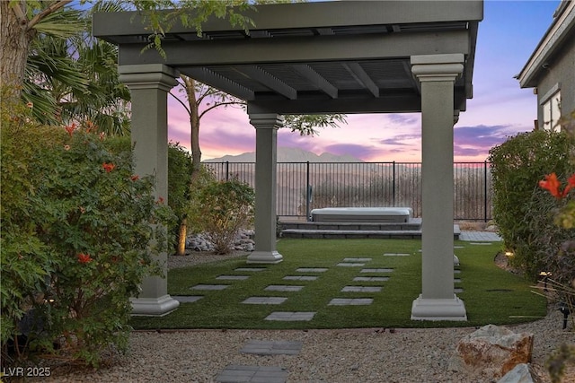 view of yard at dusk