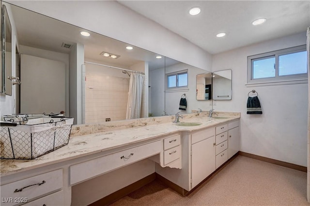 bathroom with vanity and a shower with shower curtain