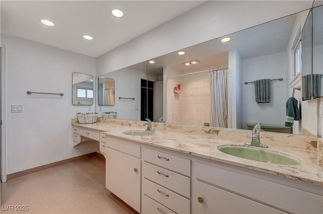 bathroom featuring vanity and curtained shower