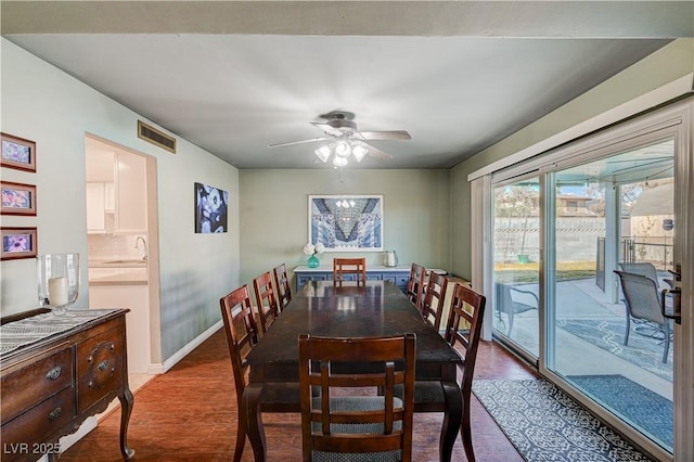 dining room with hardwood / wood-style flooring and ceiling fan