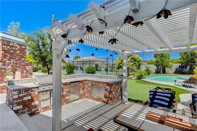 view of patio / terrace featuring a bar, area for grilling, grilling area, a pergola, and a fenced in pool