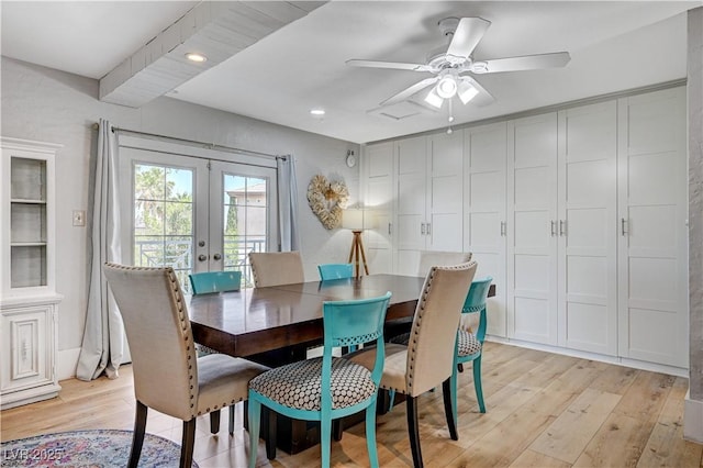 dining room with ceiling fan, light wood-type flooring, and french doors