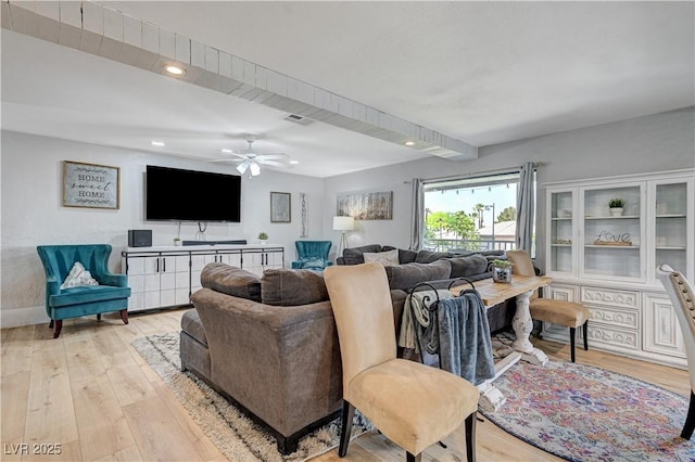 living room featuring ceiling fan and light wood-type flooring