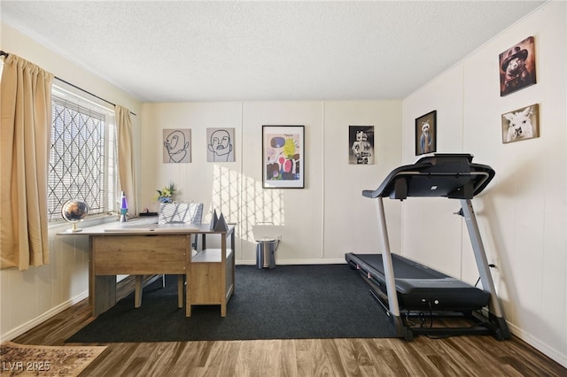 interior space with dark hardwood / wood-style floors and a textured ceiling