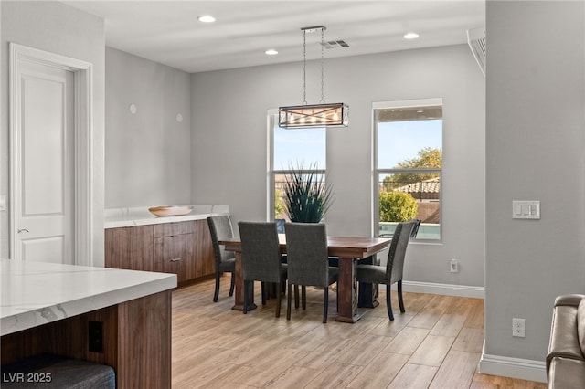 dining room featuring light hardwood / wood-style floors