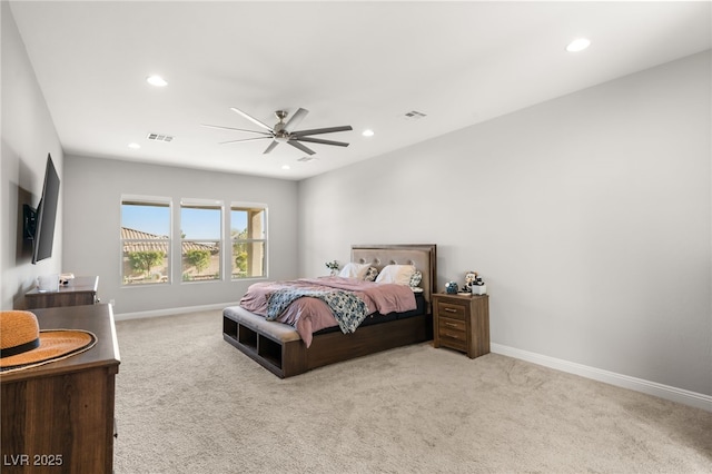 bedroom with light carpet and ceiling fan