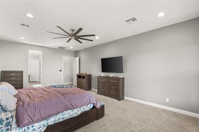 bedroom featuring light colored carpet and ceiling fan