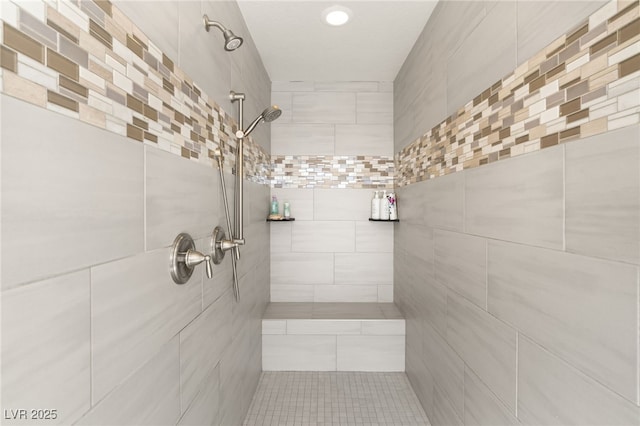 bathroom with tiled shower