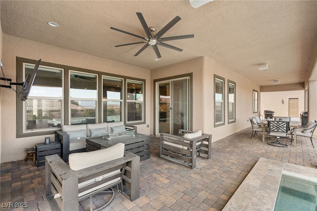 view of patio featuring outdoor lounge area and ceiling fan