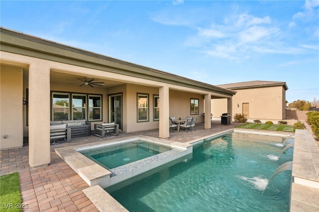 rear view of house featuring ceiling fan, outdoor lounge area, a patio, a pool with hot tub, and pool water feature