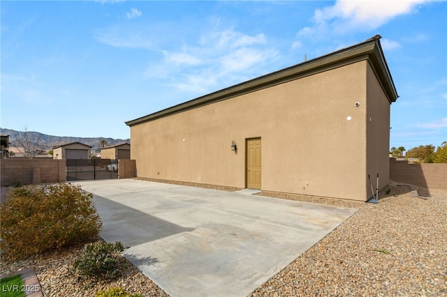 view of property exterior featuring a patio area