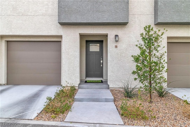 doorway to property featuring a garage