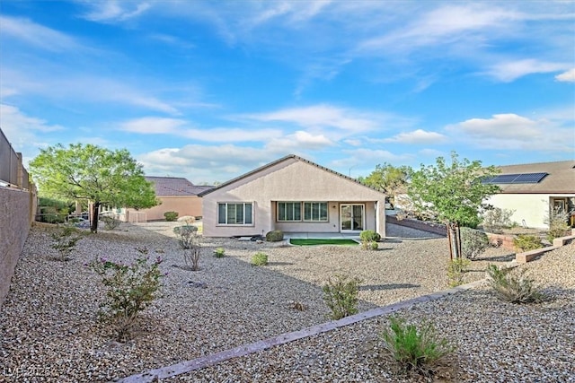 back of house with a patio