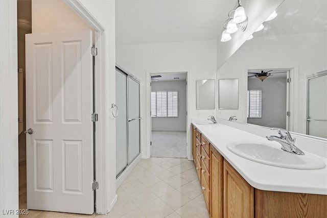 bathroom with vanity, tile patterned flooring, and walk in shower