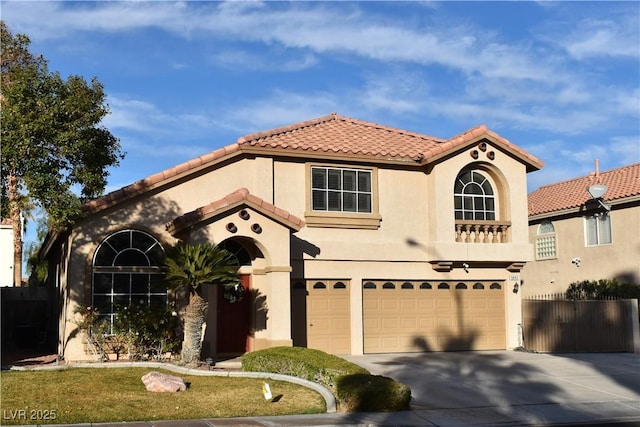 mediterranean / spanish home featuring a garage