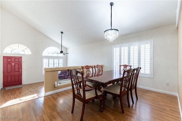 dining space with wood finished floors, baseboards, and a wealth of natural light