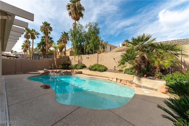 view of swimming pool with a fenced in pool, a fenced backyard, and a patio area